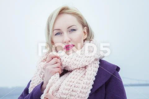 Young female blonde who wears a big bouffant scarf Stock Photos