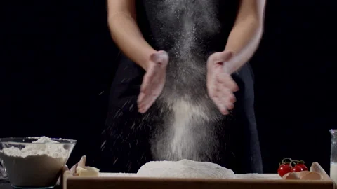 Young Female Chef Clapping Her Hands Filled With White Flour Stock Footage 170239458