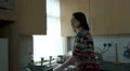 Young female cleaning plates HD Footage