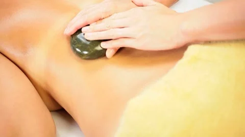 Young Female Client Receiving Hot Stone Massage Stock Footage 7901744