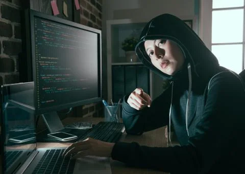 Young female computer programmer as hacker Stock Photos