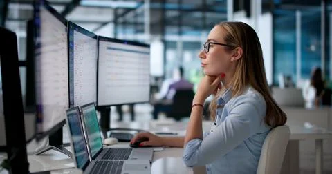 Young Female Customer Support Agent Using Laptop To Resolve Help Desk Tickets Stock Photos