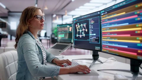Young Female Cybersecurity Expert Analyzing Threat Data Stock Footage 340998690