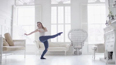 Young female dancer dancing in a beautiful apartment, in slow motion Stock Footage 88164975