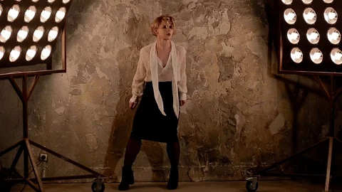 Young female dancer dancing in front of studio light Stock Footage 90455183