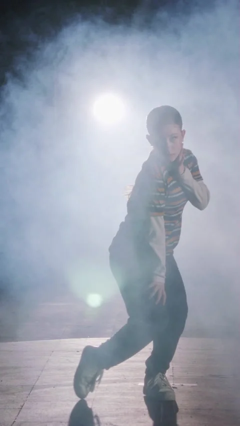 Young female dancer performing hip hop dance in slow motion with light and smoke Stock Footage 202129797