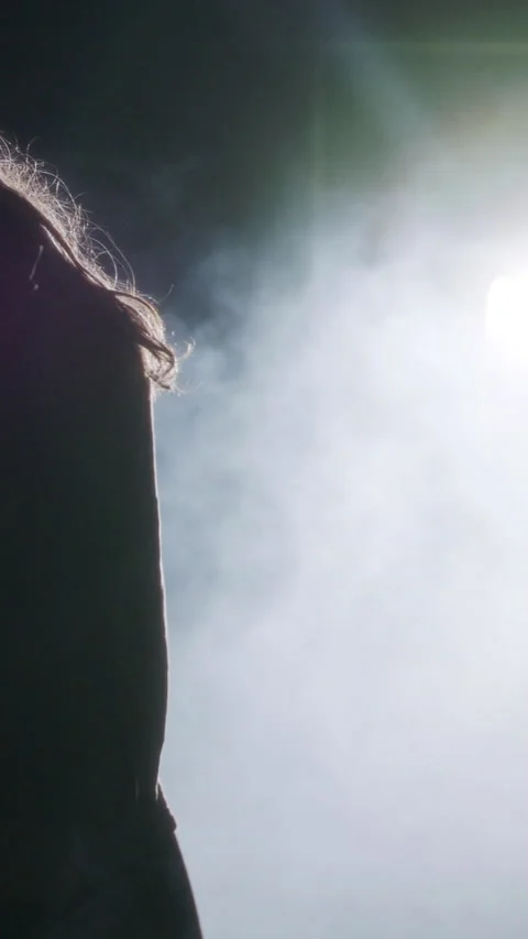 Young female dancer performing wild hip hop dance with strobe light and smoke Stock Footage 202131968