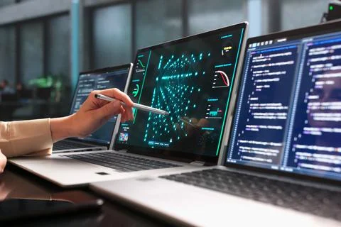 Young Female Data Scientist Studies Neural Network Models Using Laptop Comput Stock Photos