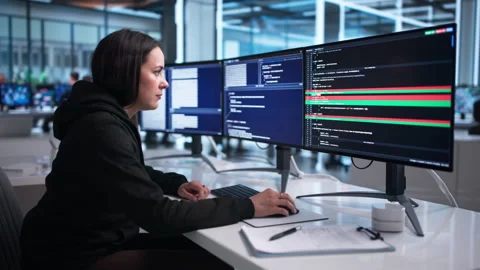 Young Female Developer Reviews Code Differences 動画素材 339175377