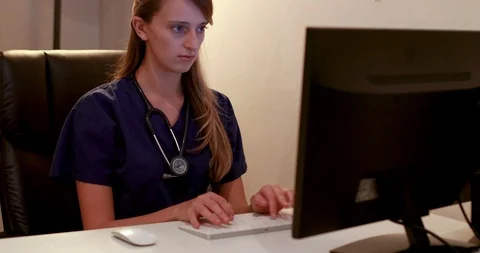 Young female doctor using computer Stock Footage 88686417