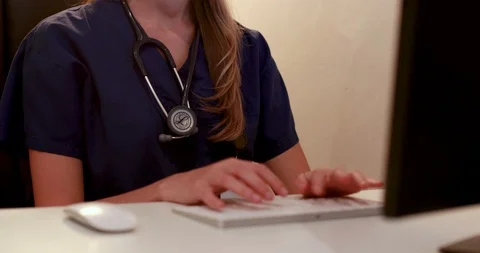 Young female doctor using computer Stock Footage 88687510