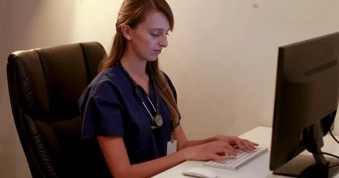 Young female doctor using computer Stock Footage 88687984