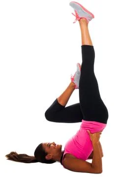 Young female doing exercise, stretching her leg Stock Photos