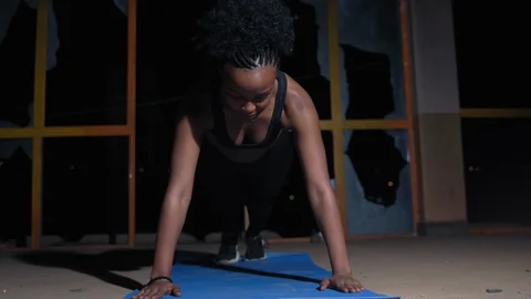 Young female doing push ups in the hall 스톡 동영상 115790983