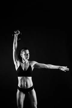 Young female doing swing exercise with a kettle bell. Fitness woman Stock Photos