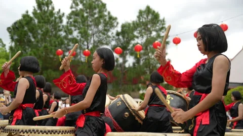 Young female drummers are performing at the Chinese New Year culture festival Stock Footage 234400580