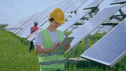 Young female ecological engineer uses digital tablet she collected efficient Stock Footage 202487093