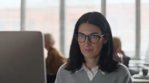 Young Female Employee Working on PC in Open Space Office Stock Footage 321047564