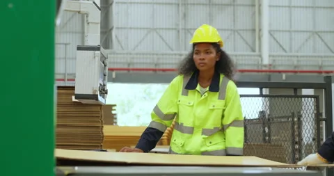 Young female engineer controlling machine at factory. Stock Footage 249988501