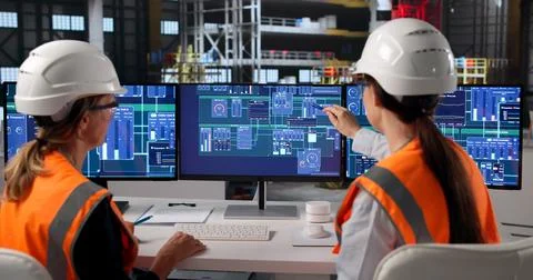 Young Female Engineer Discusses Rocket System Software With Team. Stock Photos
