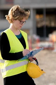 Young female engineer at work on construction site Stock Photos