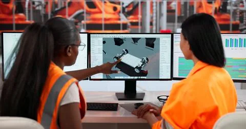 Young Female Engineers Collaborate Using CAD Software Designing Electric Cars Stock Photos