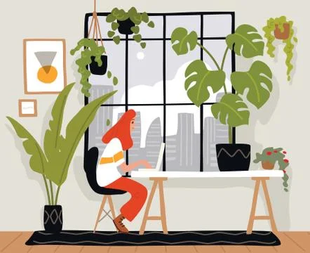 Young female freelancer is working on a computer, sitting at the table. Artis イラスト素材