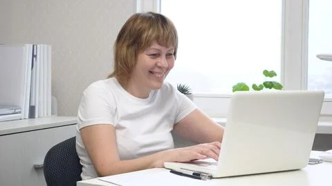 Young Female Freelancer Working on a Computer Stock Photos