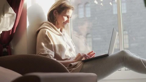 A young female freelancer working from home Stock Footage 140403301