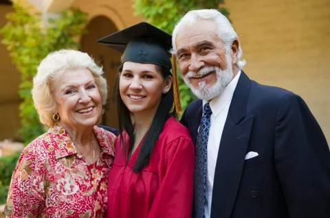 Young Female Graduate With Grandparents Stock Photos