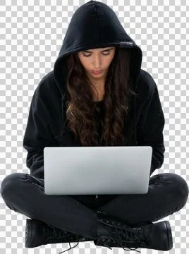Young female hacker using laptop while sitting Stock Photos