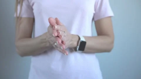 Young female hands. Interlocked palms. Massage of women's palms, close-up. Stock Footage 303133128