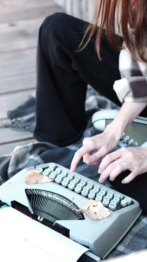 Young female hands of a writer typing on a typewriter, on the street Stock Footage 291369596