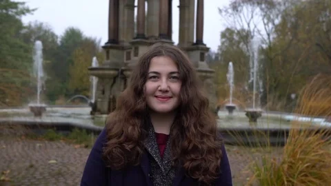 Young female looking at camera. Portrait of a happy young female. Close up face Stock-Footage 70602784