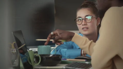 Young Female Manager Discussing Programming Code with IT Specialist Stock Footage 263730683