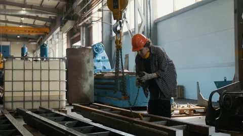 Young Female Material Handler Attaching Lifting Chains in Metalworking Shop Video stock 320675708