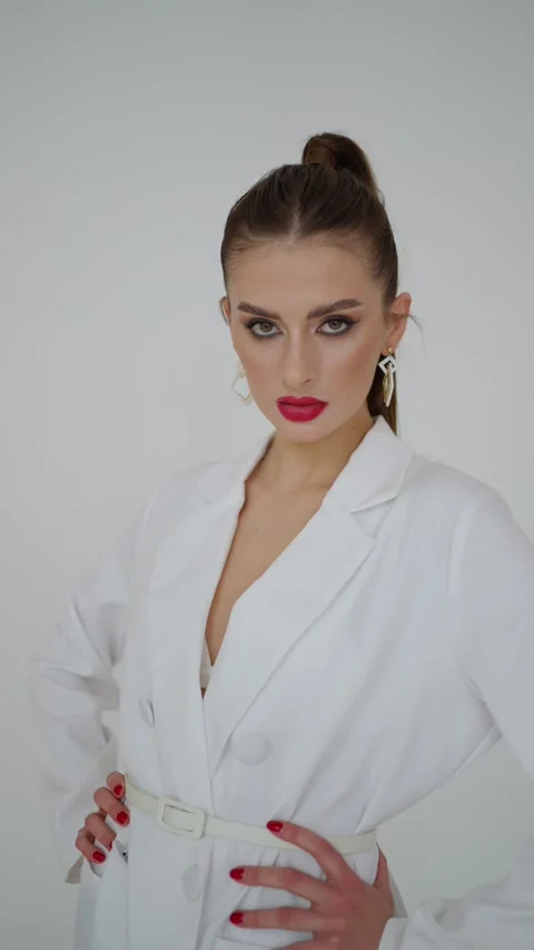 Young female model with bright makeup in the studio Stock Footage 256708198