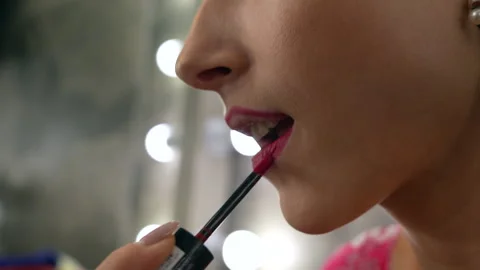 Young female model is doing her makeup in the dressing room. Stock-Footage 281232733