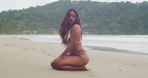 Young female model posing on tropical beach during summer travel. Video stock 347182835
