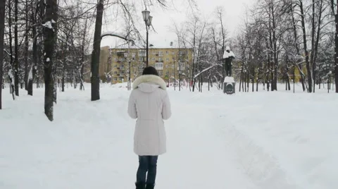 Young female model posing in winter park Stock Footage 2647556