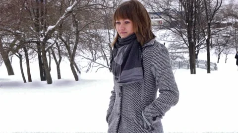 Young female model posing in winter park Stock Footage 8684480