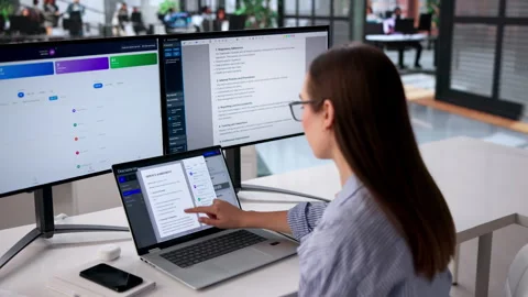 Young Female Office Manager Efficiently Organizing Documents Stock Footage 332908776