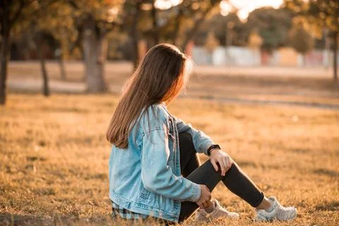 Young female posing in spring sunset park Stock Photos