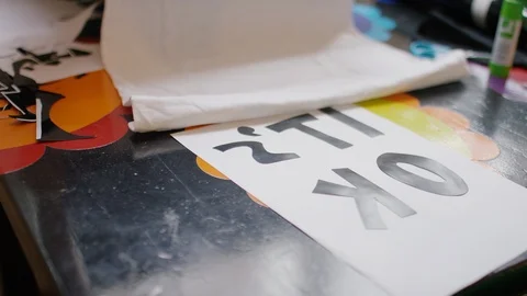 Young female preparing her tee shirt design for printing on the heat press Stock Footage 112023629
