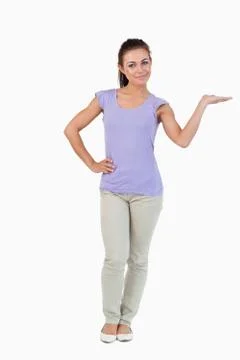 Young female presenting with her palm lifted Stock Photos