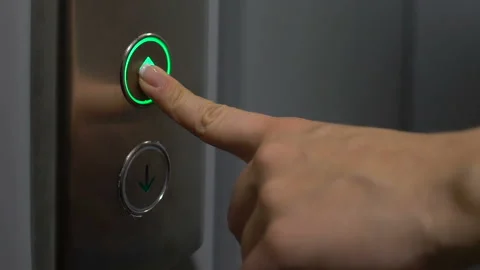Young female pressing up button in elevator, modern office building, house Video stock 116408209