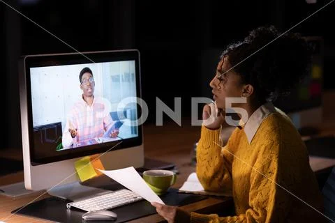 Young female professional having on line meeting in office Stock Photos
