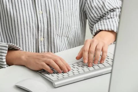 Young female programmer with computer typing on keyboard in office, closeup 스톡 사진