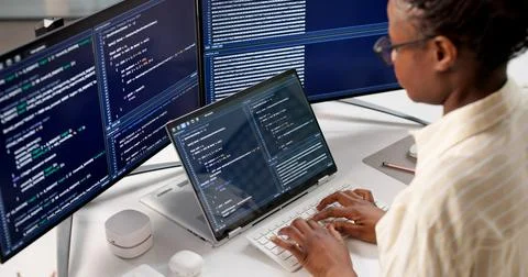 The Young Female Programmer Developing Software On Her Desktop Computer 스톡 사진