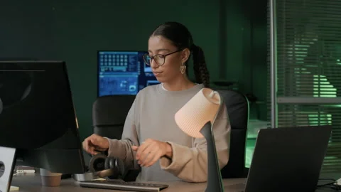 Young Female Programmer Getting Ready to Work on Computer in Office at Night Stock Footage 292618917